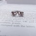 9301 LOVE ADJUSTABLE AMERICAN-DIAMOND RING